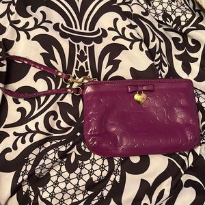 Purple coach wristlet - used, great condition.